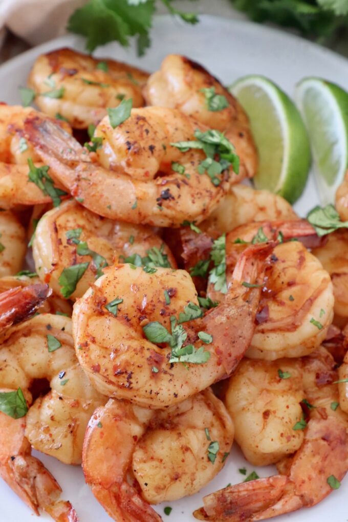 marinated cooked shrimp on plate with cilantro