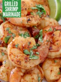 cooked shrimp on plate with lime wedge