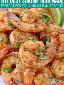 cooked shrimp on plate with lime wedge
