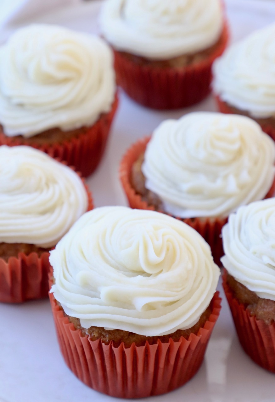pumpkin cupcakes with cream cheese frosting on plate