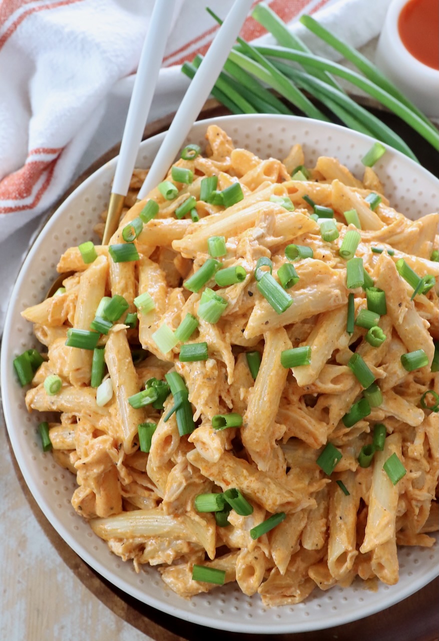 buffalo chicken pasta in bowl with forks