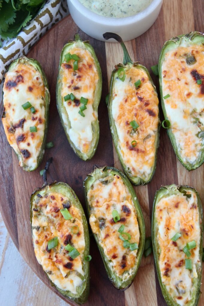 grilled jalapeno poppers on wood cutting board