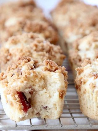 Maple Bacon Muffins on wire rack with bite of muffin taken