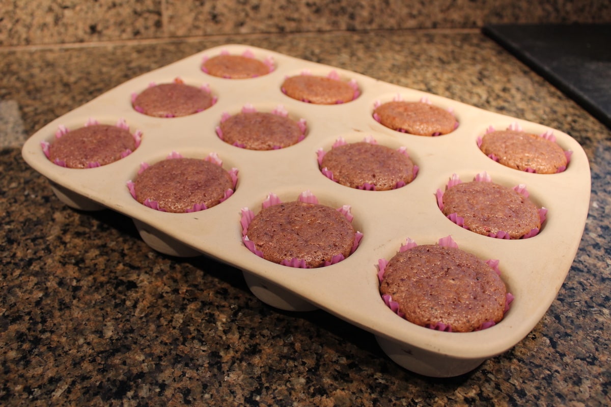 Baked Strawberry Kiwi Cupcakes in a muffin pan