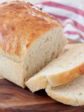 Sliced potato bread on wood cutting board