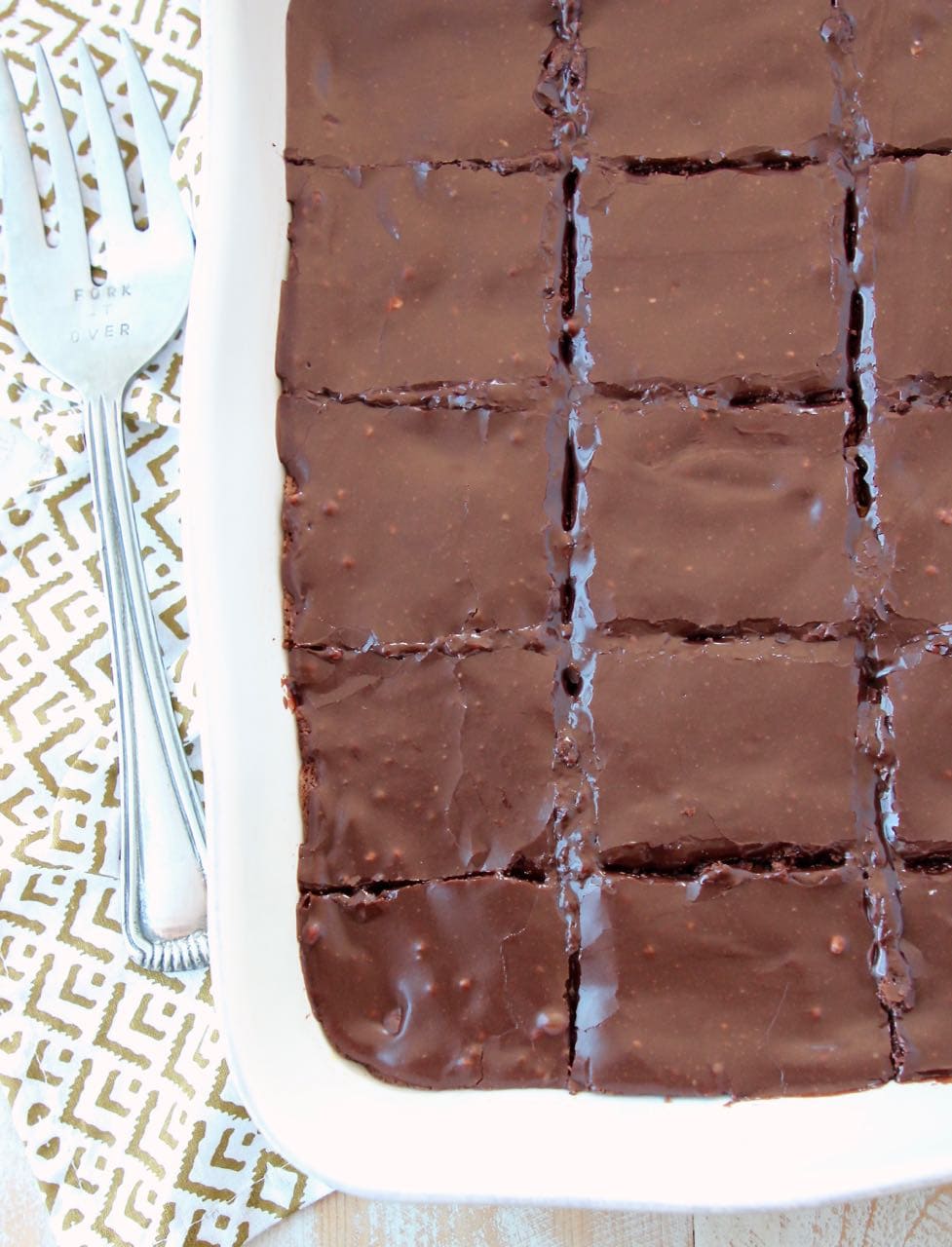 Chocolate brownies in baking dish, sliced into squares