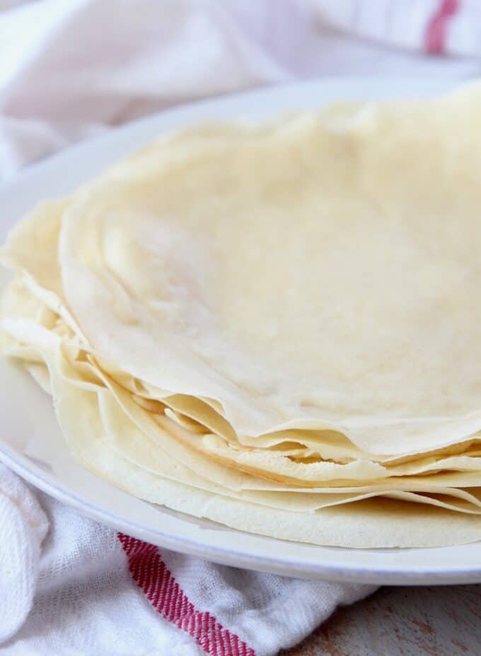 crepes stacked on top of each other on a plate