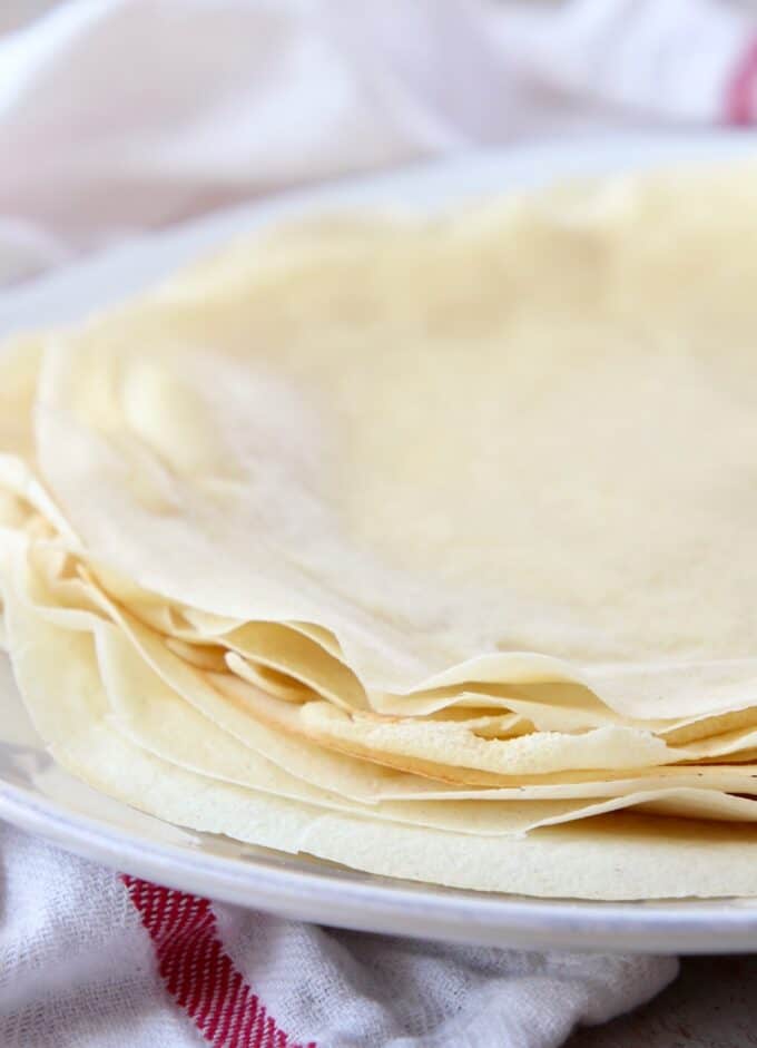 crepes stacked on top of each other on a plate