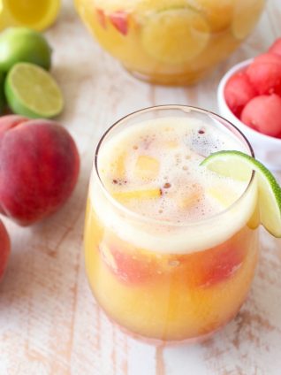 This white peach sangria is the perfect summer cocktail recipe combining refreshing white wine with fresh peaches, nectarines and lime juice!