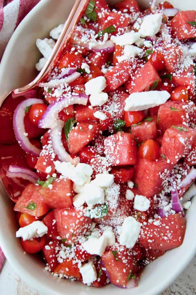 Diced watermelon salad in bowl with spoon