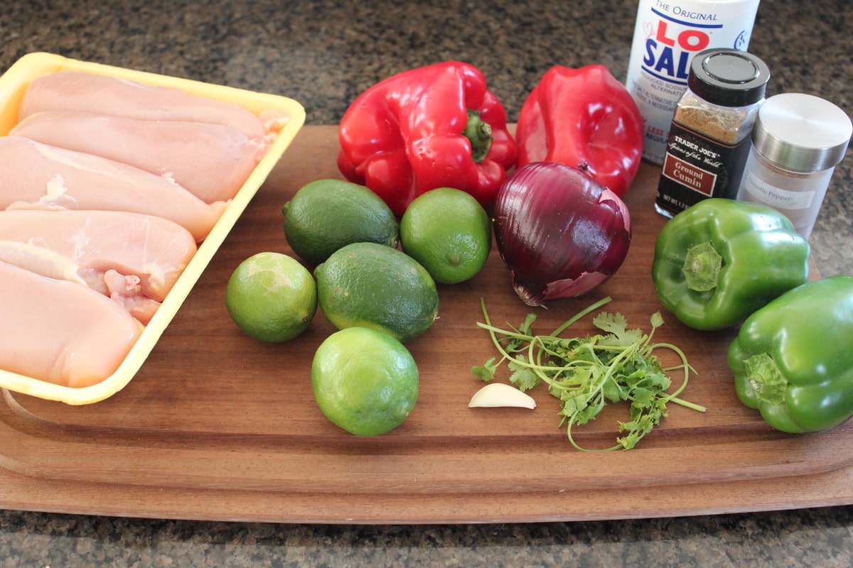 Chicken Fajita Skewer Ingredients on a wooden cutting board