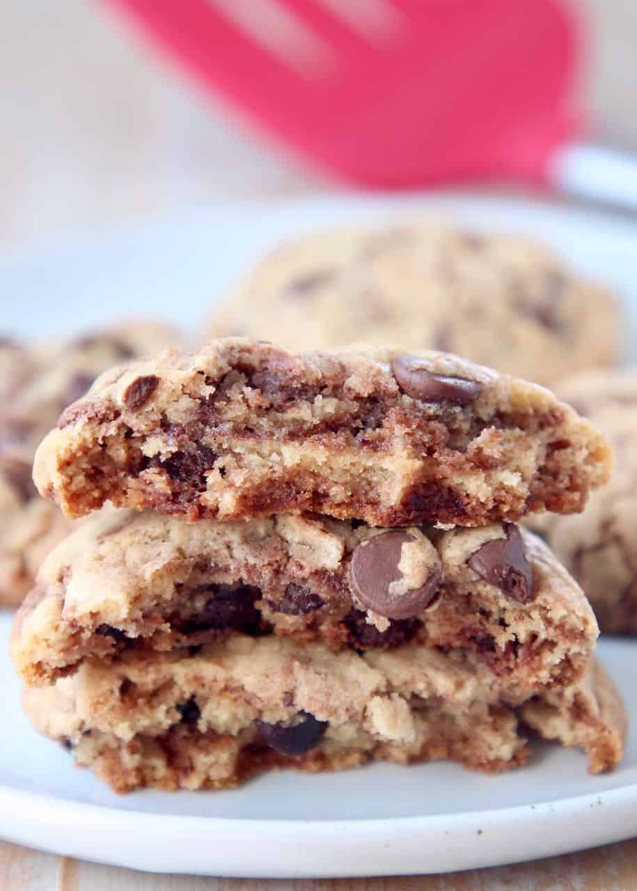 Nutella chocolate chip cookies broken in half and stacked on top of each other