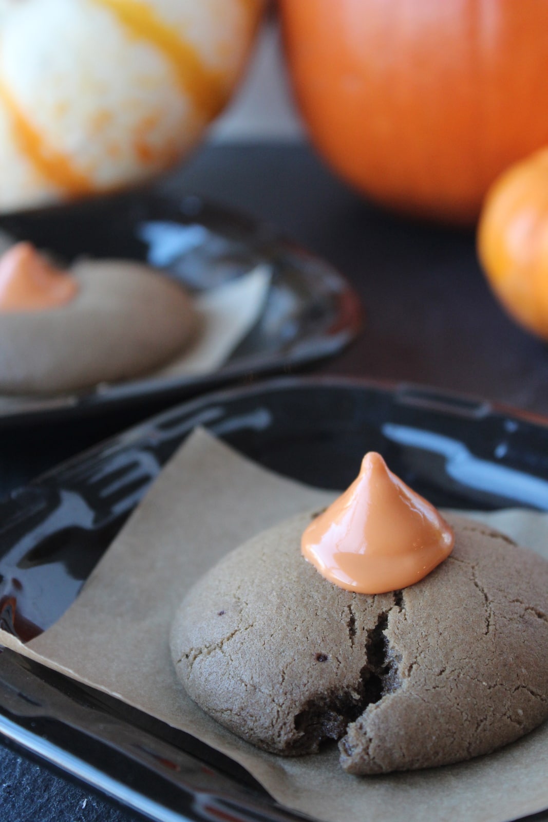 Pumpkin Kiss Cookies on a black plate