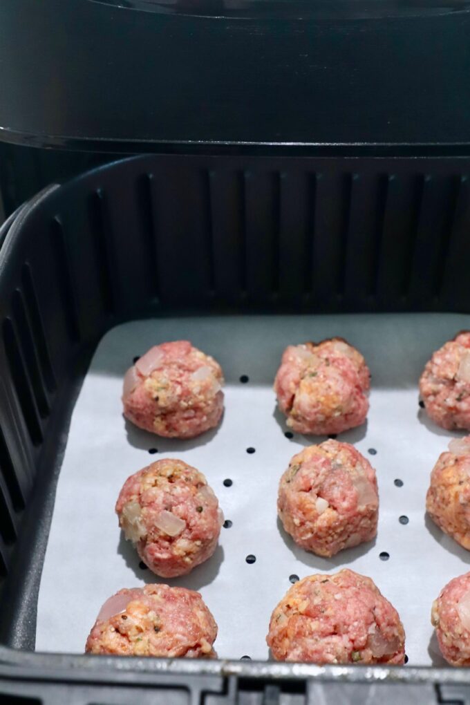 raw meatballs in air fryer basket