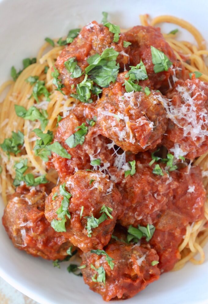 meatballs tossed in marinara sauce in bowl with pasta
