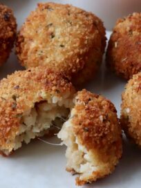 cooked arancini on plate