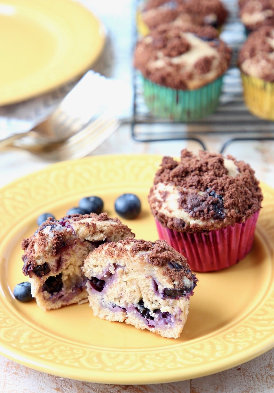 Blueberry Cream Cheese Muffins with Fresh Blueberries on Yellow Plate