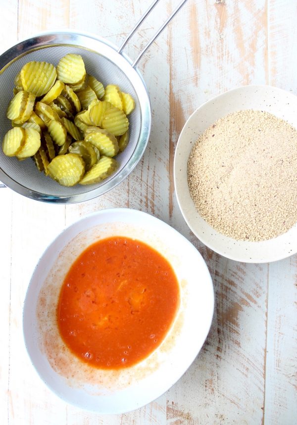 Pickle Chips are dipped in buffalo sauce, then rolled in a spicy Rice Chex mixture and baked golden brown for the perfect gluten-free & vegetarian snack!