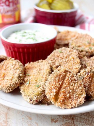 Pickle Chips are dipped in buffalo sauce, then rolled in a spicy Rice Chex mixture and baked golden brown for the perfect gluten-free & vegetarian snack!