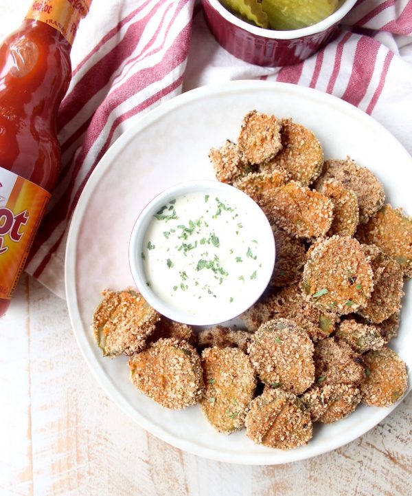 Pickle Chips are dipped in buffalo sauce, then rolled in a spicy Rice Chex mixture and baked golden brown for the perfect gluten-free & vegetarian snack!