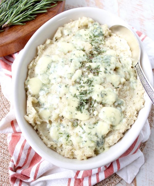 Warm rosemary herb infused butter is added to these blue cheese mashed potatoes for the best potato side dish you'll ever have in your life!