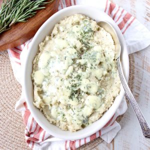Warm rosemary herb infused butter is added to these blue cheese mashed potatoes for the best potato side dish you'll ever have in your life!
