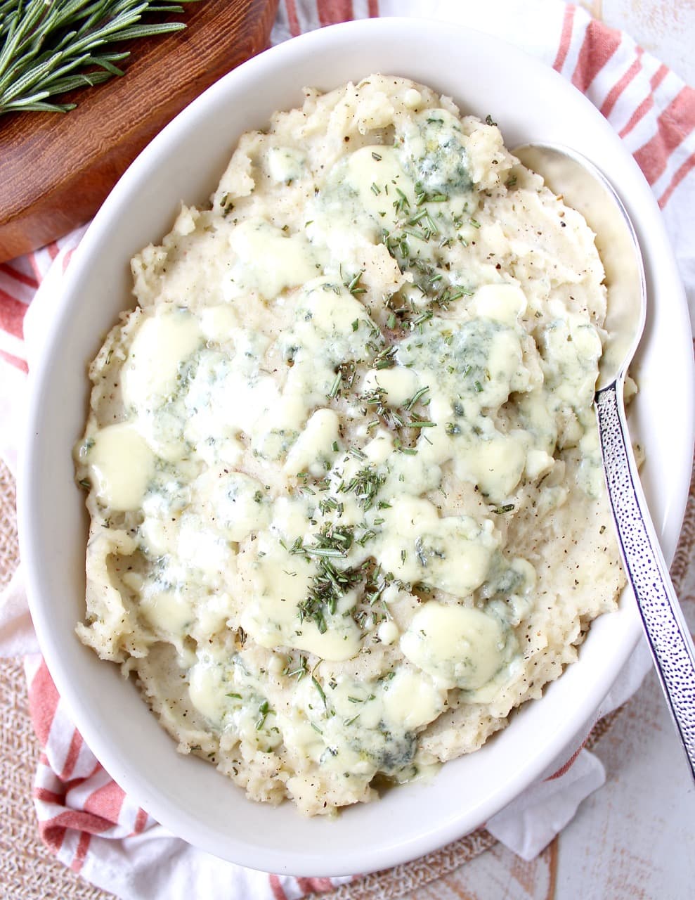 mashed potatoes in bowl with serving spoon
