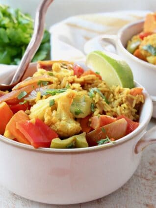 curry casserole in bowls with fork