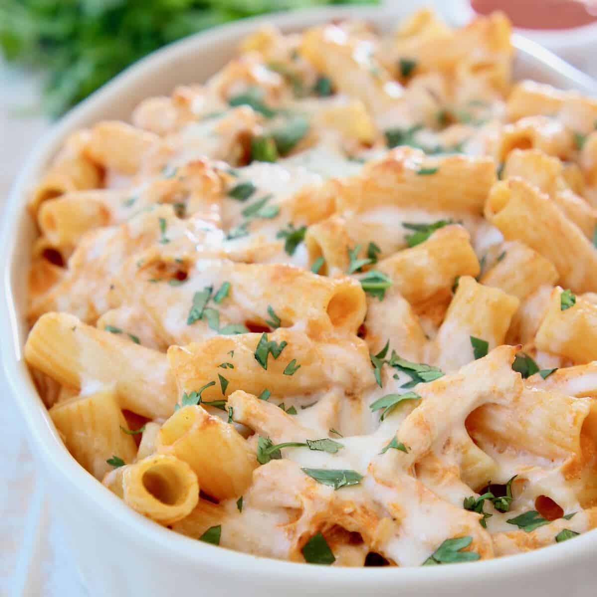 Cheesy baked pasta in casserole dish