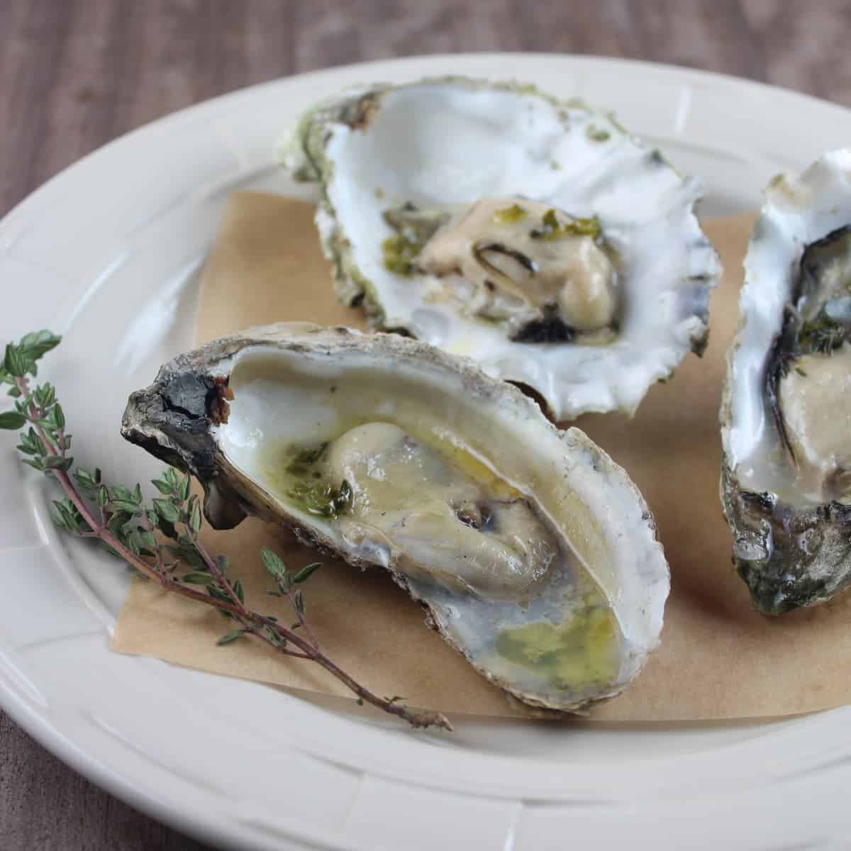 Grilled Oysters with Thyme Jalapeño Sake Brown Butter