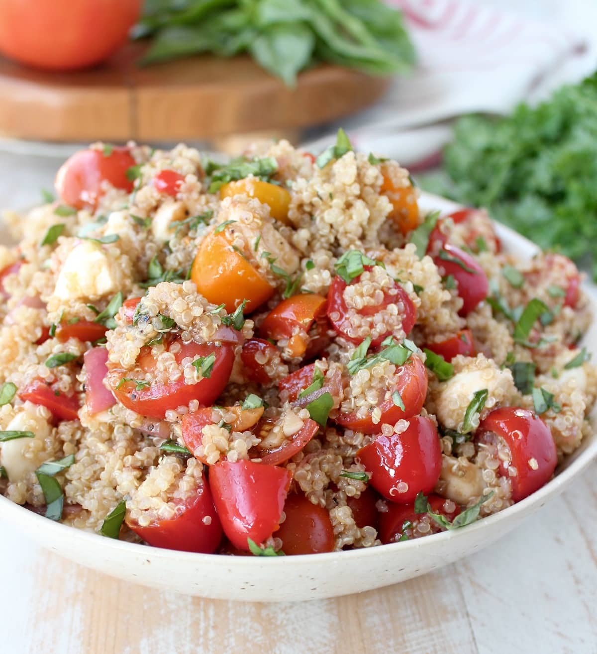 Quinoa Caprese Salad in a white bowl. 