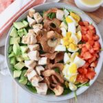 cobb salad in bowl with apple chips