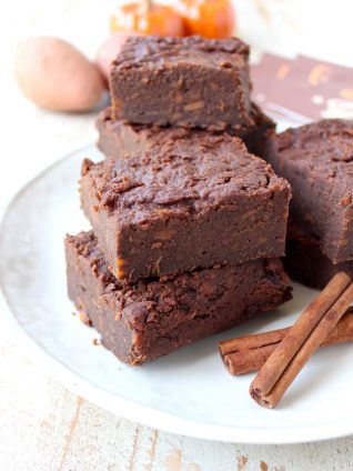 Gluten Free Sweet Potato Brownies are a rich and creamy treat, perfect for fall, topped with vanilla bean ice cream and drizzled with caramel syrup!