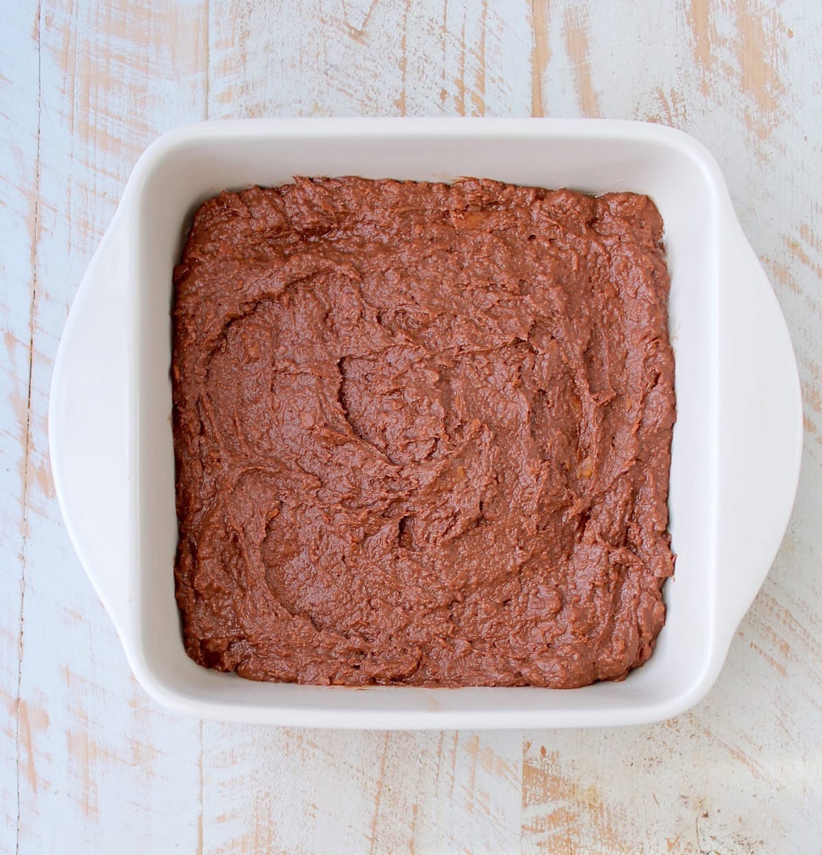Gluten Free Sweet Potato Brownies are a rich and creamy treat, perfect for fall, topped with vanilla bean ice cream and drizzled with caramel syrup!