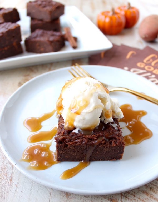 Gluten Free Sweet Potato Brownies are a rich and creamy treat, perfect for fall, topped with vanilla bean ice cream and drizzled with caramel syrup!