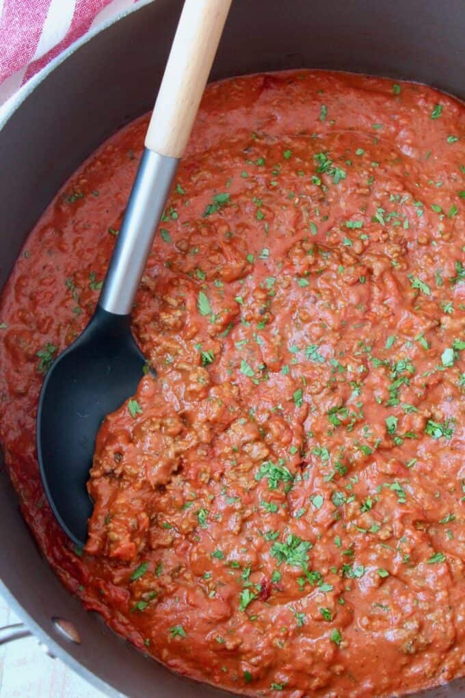 Italian meat sauce in large pot with serving spoon