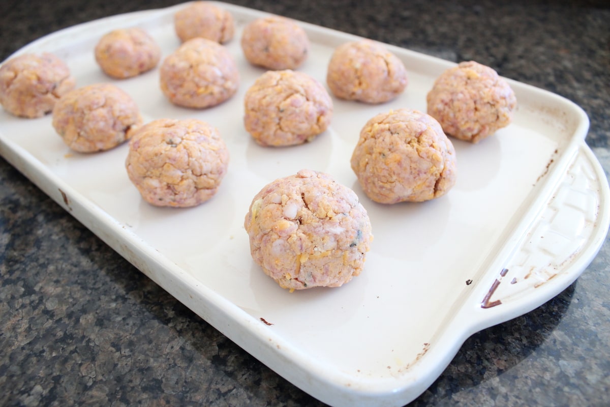 Gluten Free Sweet Potato Sausage Balls on a baking sheet.