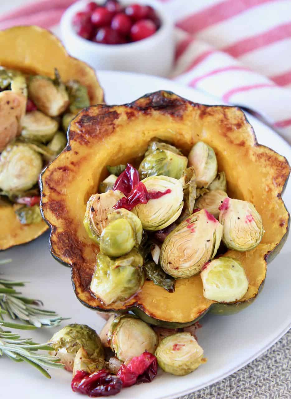 Roasted acorn squash stuffed with brussels sprouts and cranberries