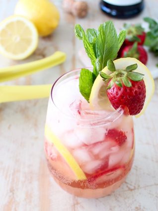 Fresh lemons and strawberries are mixed with bubbly prosecco for a refreshing prosecco sangria recipe that is perfect for spring and summer!