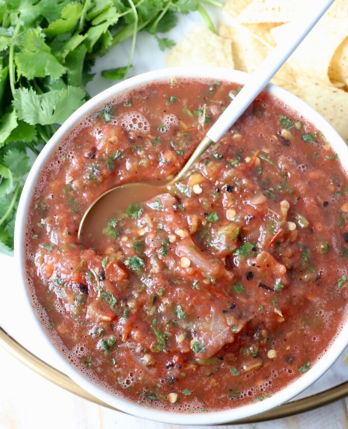 fresh tomato salsa in bowl with spoon