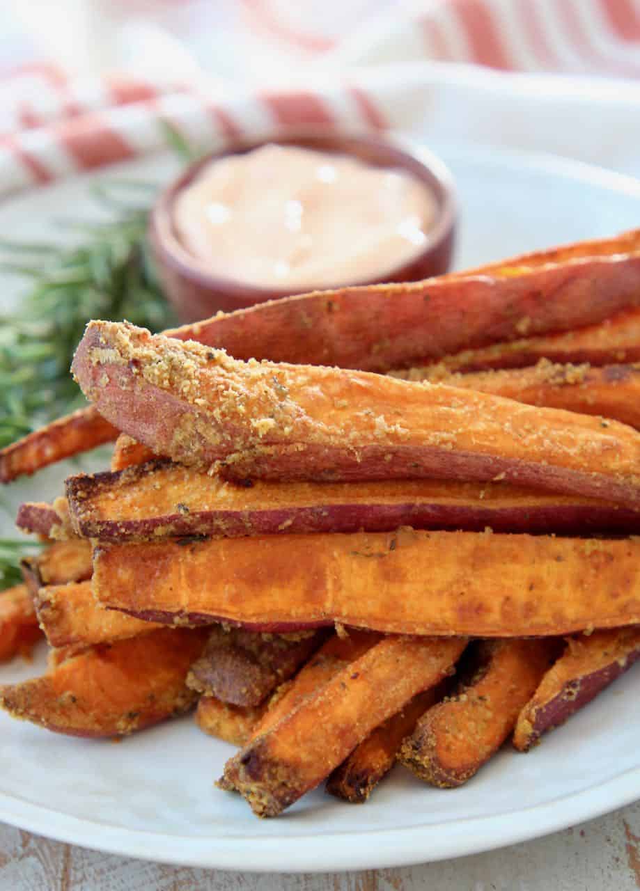 Sweet potato fries stacked up on plate