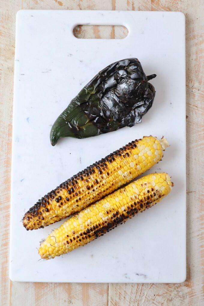 grilled corn and poblano pepper on cutting board
