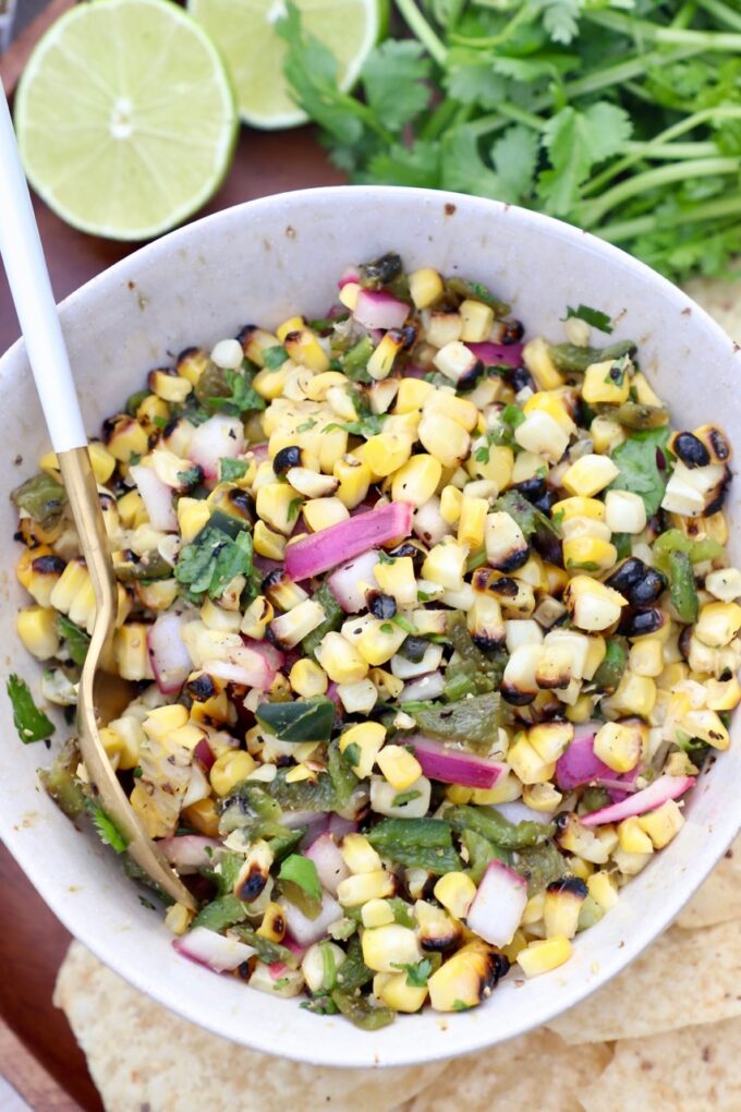 corn salsa in bowl with spoon