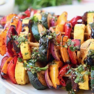 grilled vegetables on skewers on plate