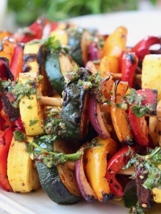 grilled vegetables on skewers on plate