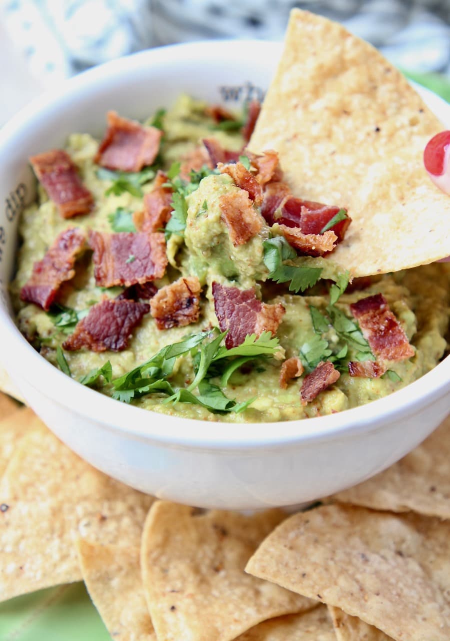 Chip dipped in bacon guacamole