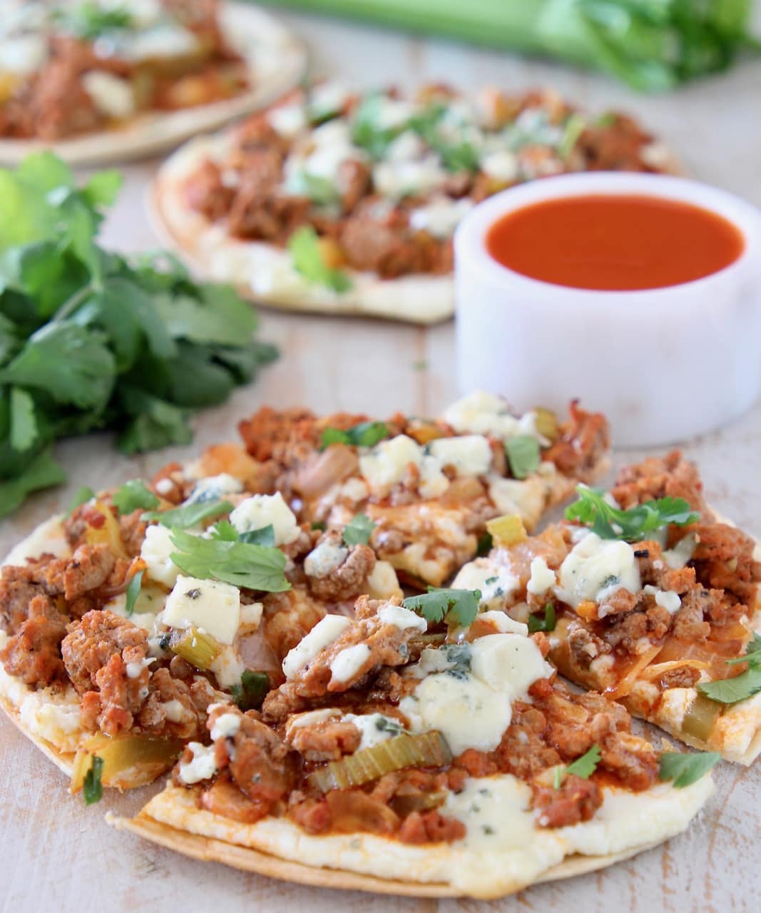 Buffalo ground turkey on flatbread topped with blue cheese crumbles