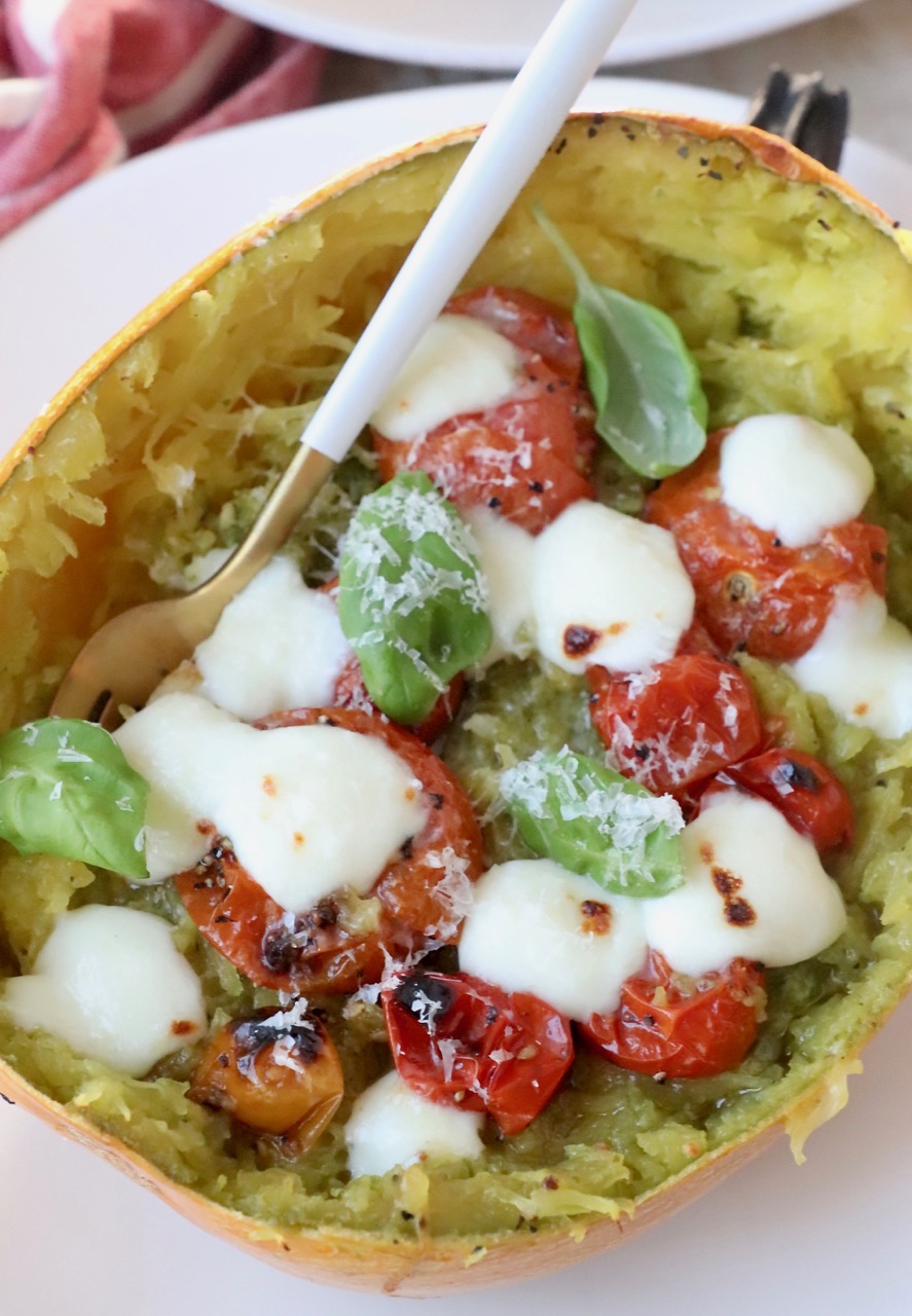 roasted spaghetti squash stuffed with tomatoes, basil and mozzarella