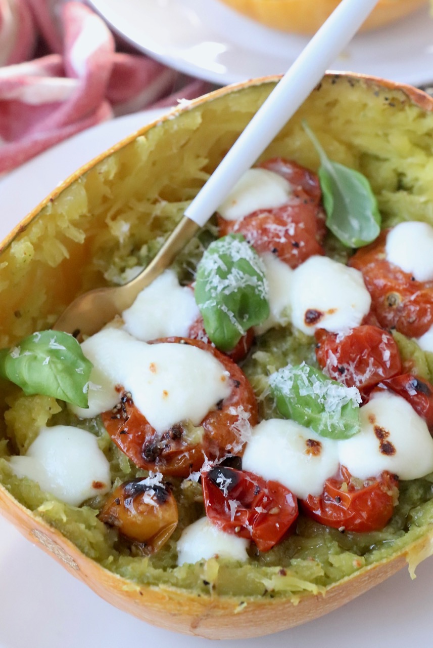 roasted spaghetti squash filled with roasted cherry tomatoes and melted mozzarella cheese