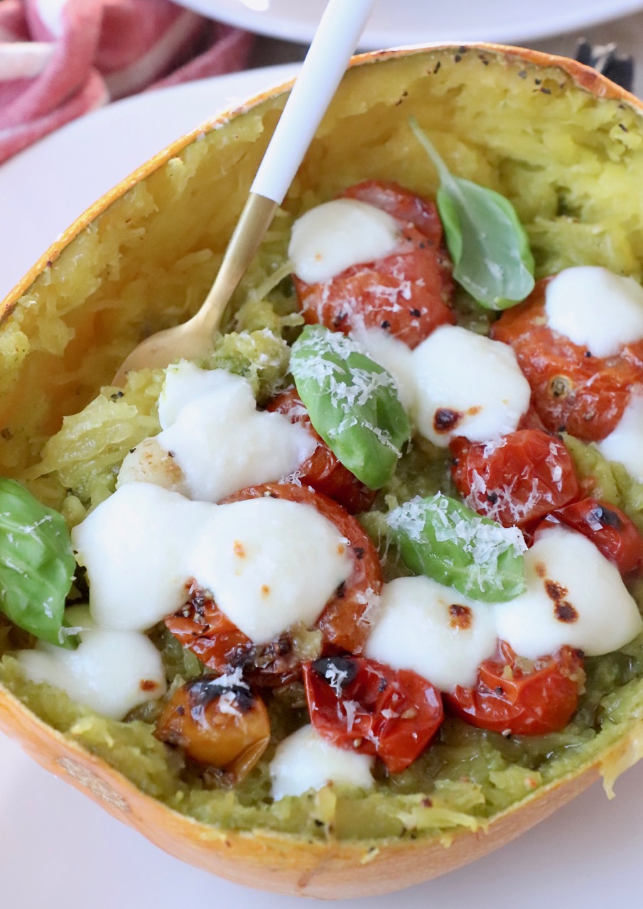 roasted spaghetti squash filled with tomatoes and mozzarella cheese